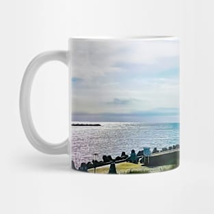 Pier with concrete breakwaters. Seascape, glare on the water of the Baltic Sea, rays of light Mug